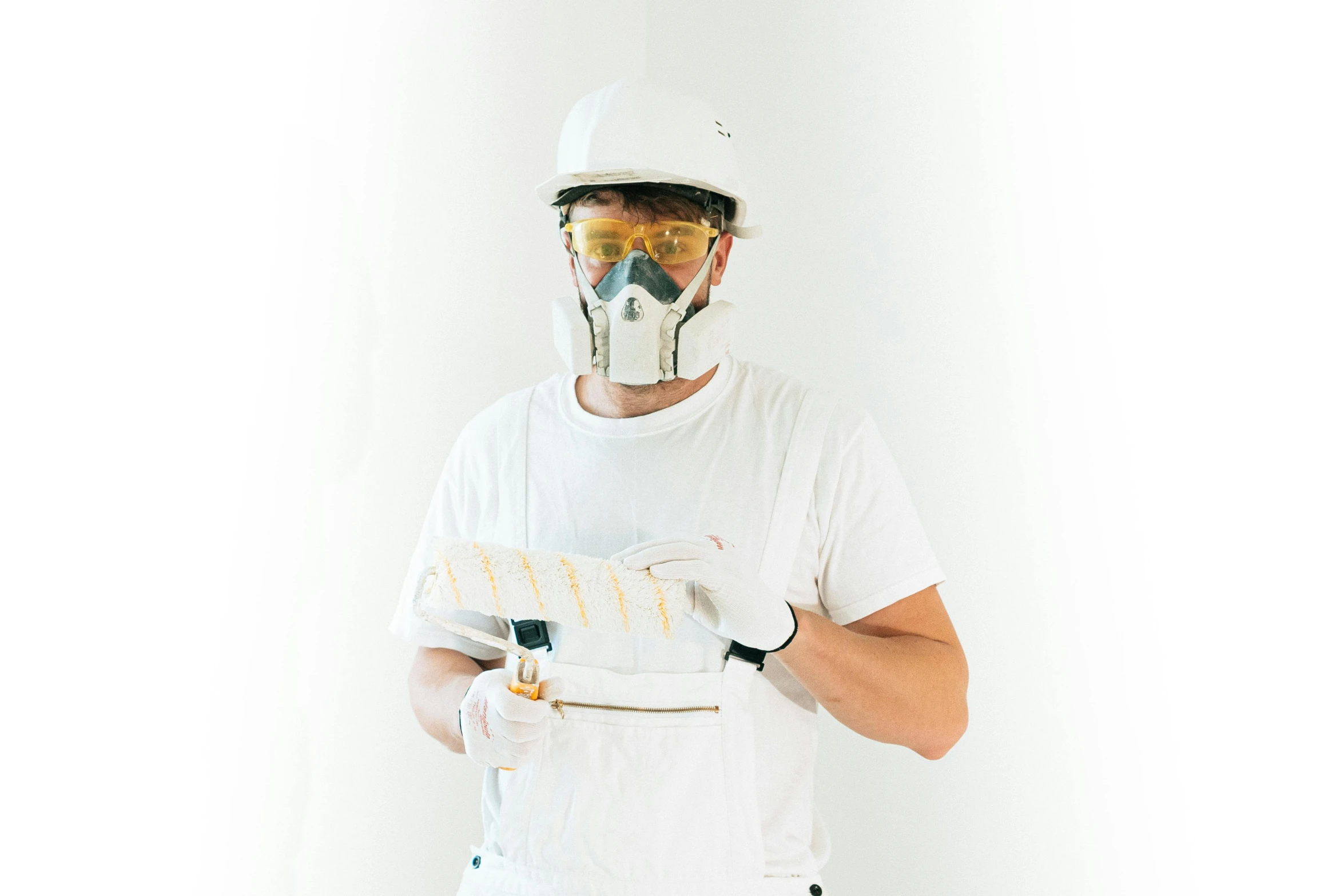 a man wearing white and silver construction gear