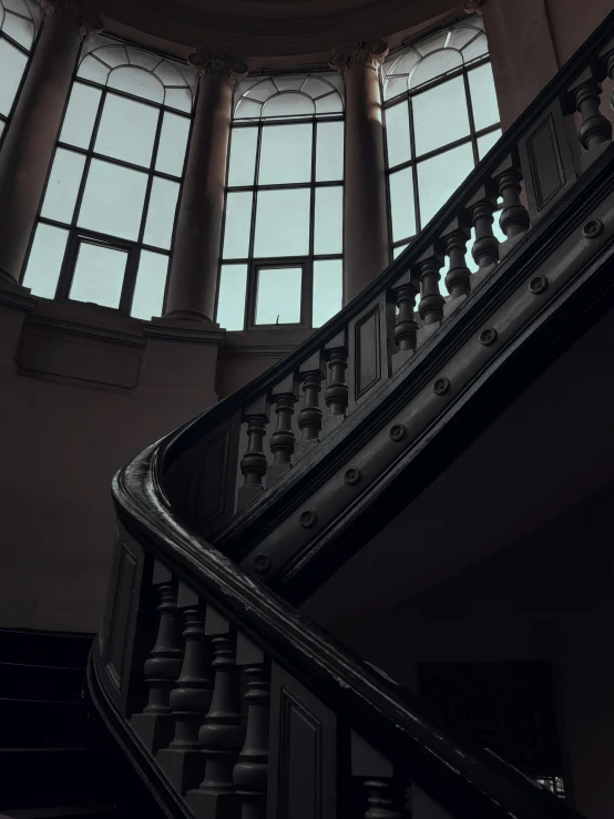 the stairs lead to a dome with an elegant balcony