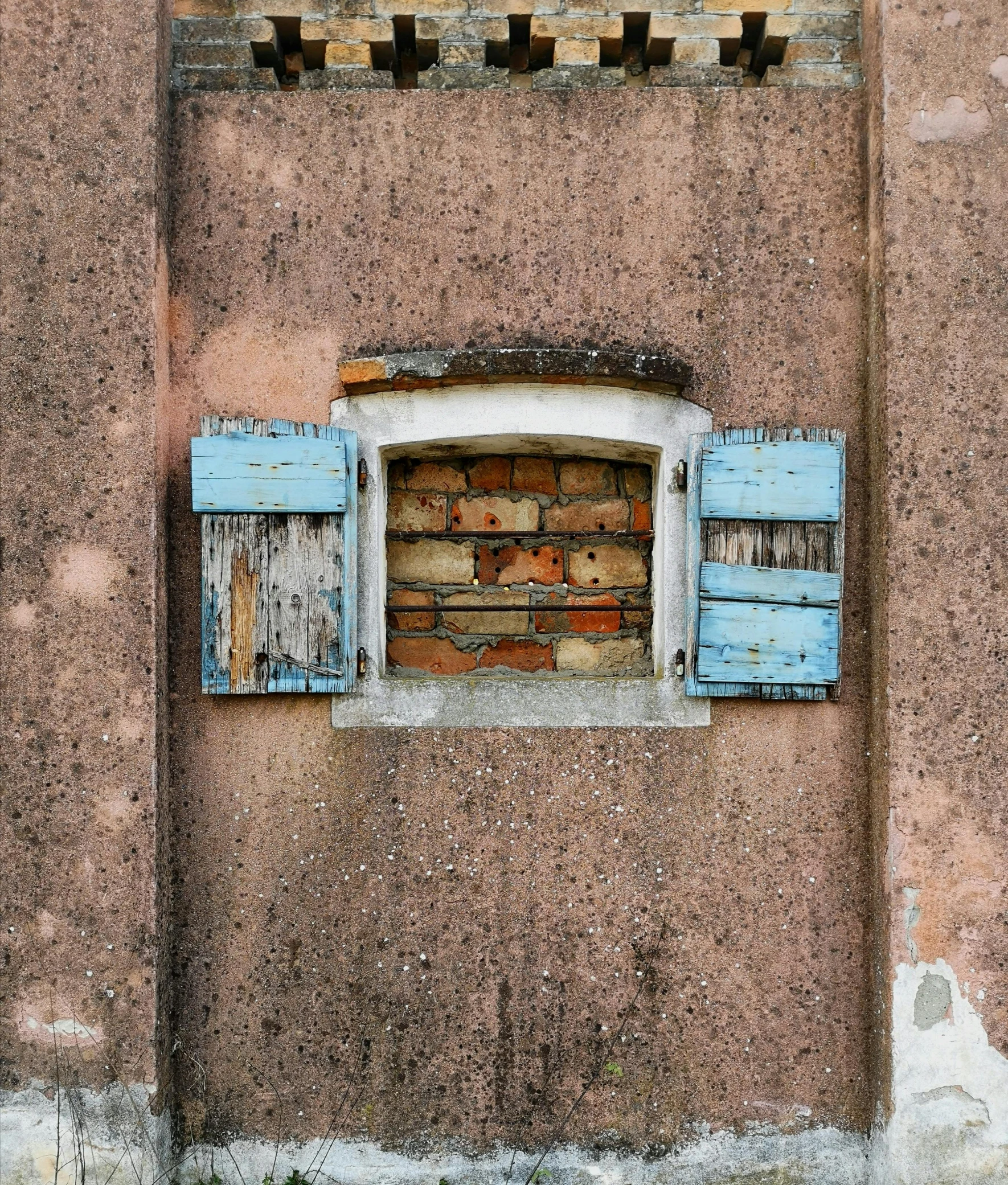 an old building that has been painted blue