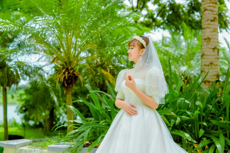 the bride is posing for the po on her wedding day