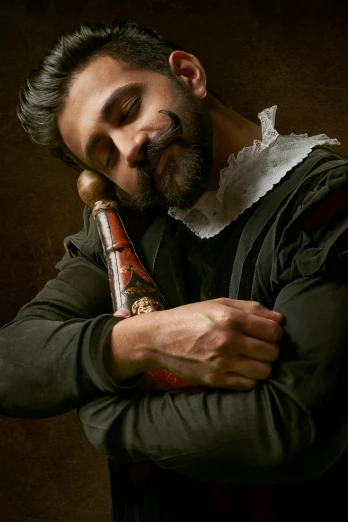 a man leaning on his face holding onto a pipe