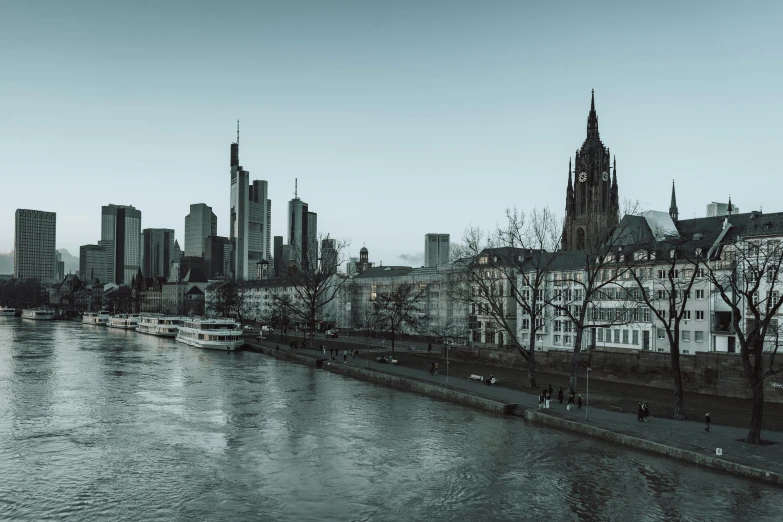 there is a old city with a river running between the buildings