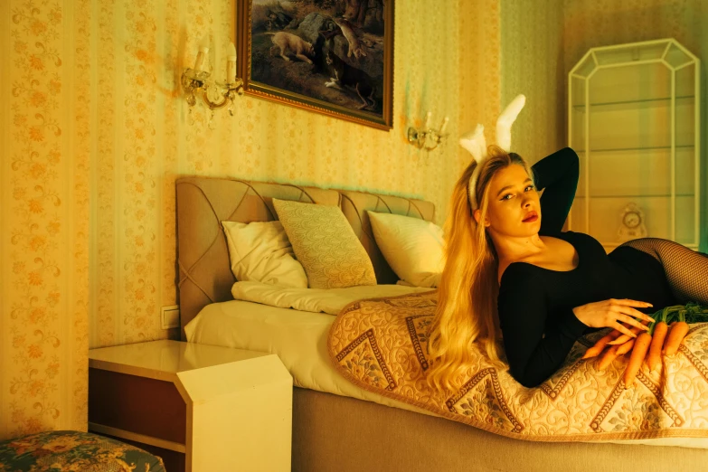 a woman with long hair laying on a bed