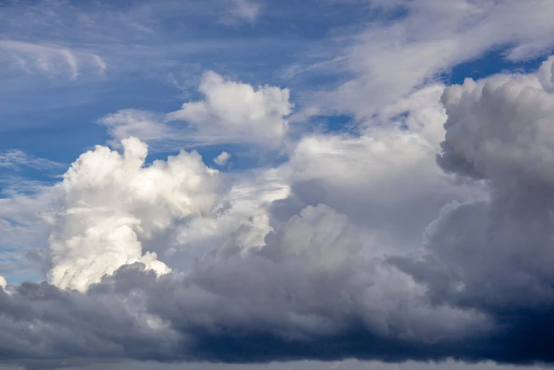 several cumshy clouds in a blue sky