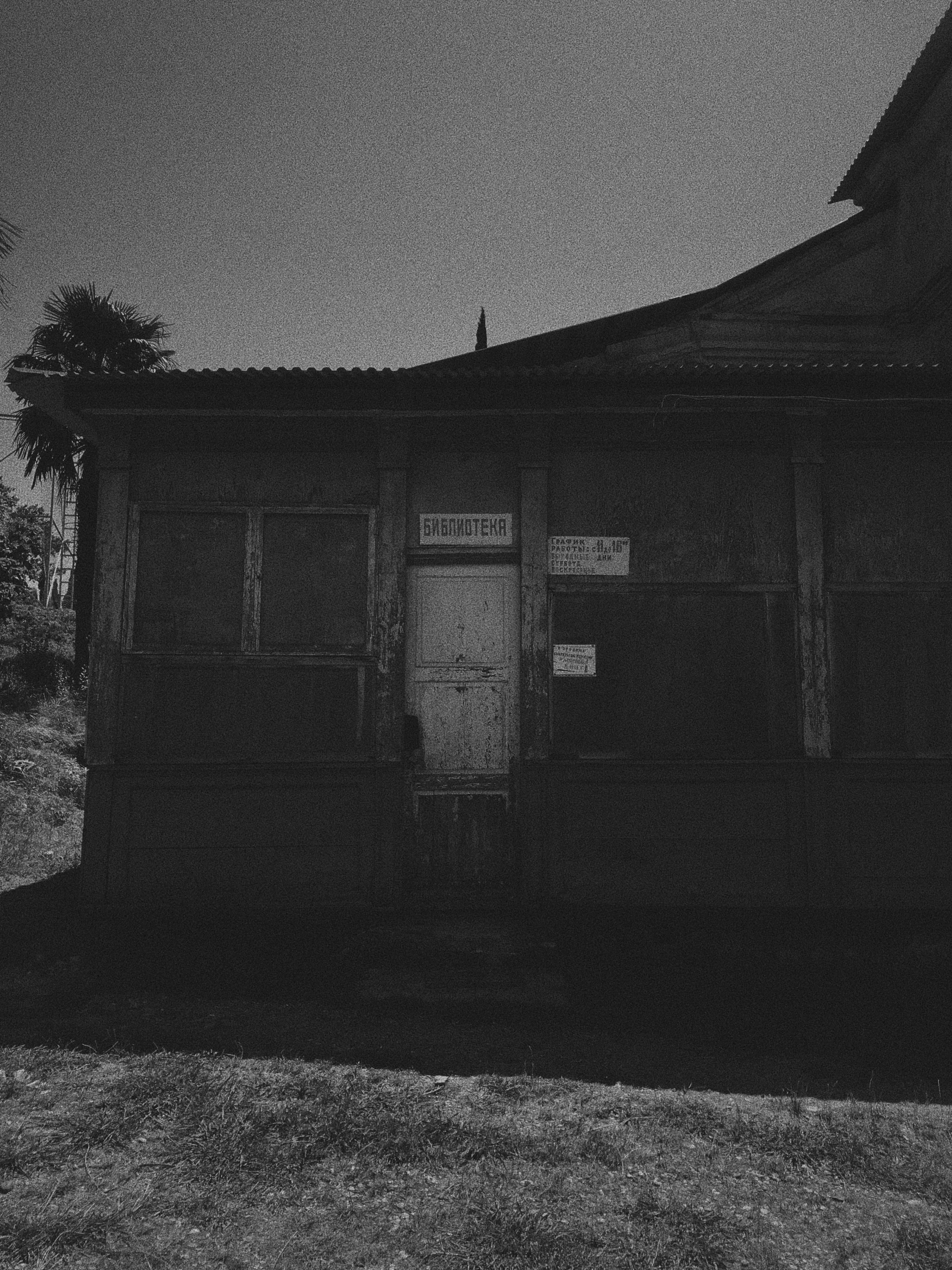 the dark house is illuminated by an open door