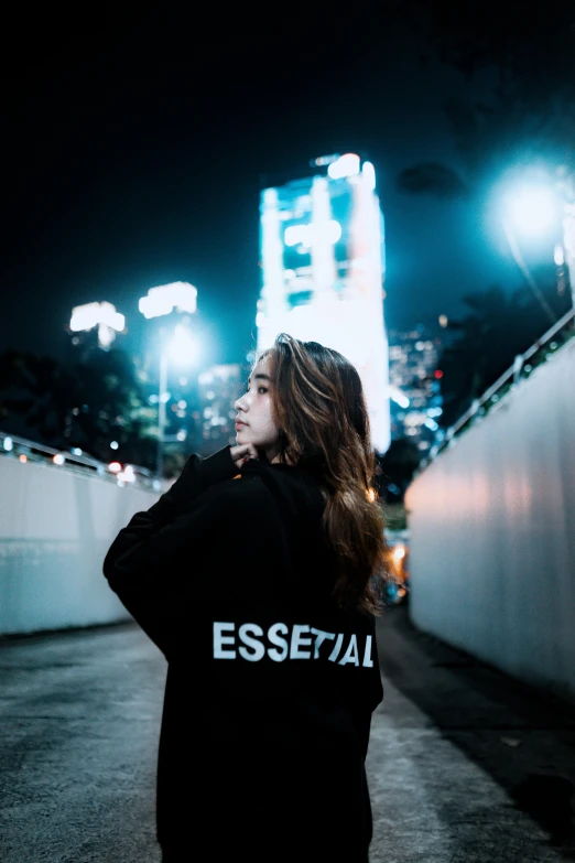 the woman is standing outside of an empty building