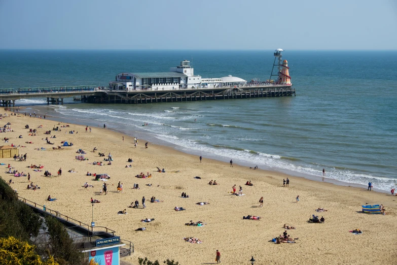 a busy beach with lots of people on it