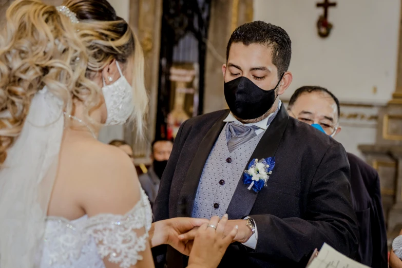 a bride and groom exchange their wedding vows