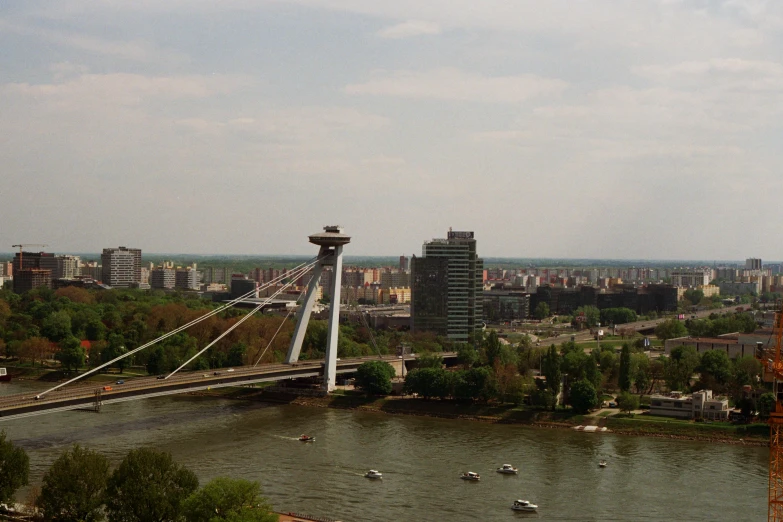 an aerial view of a bridge with a lot of boats on the water