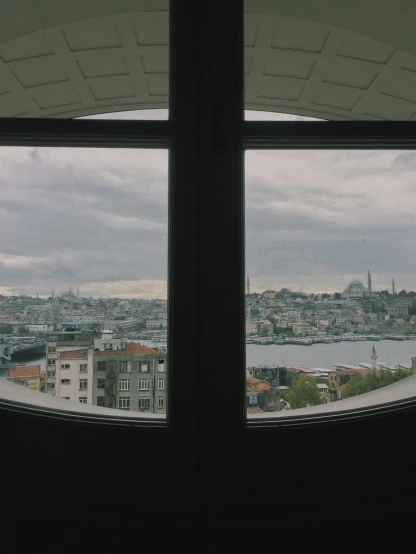 the view of the city through two windows