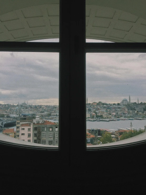 the view of the city through two windows