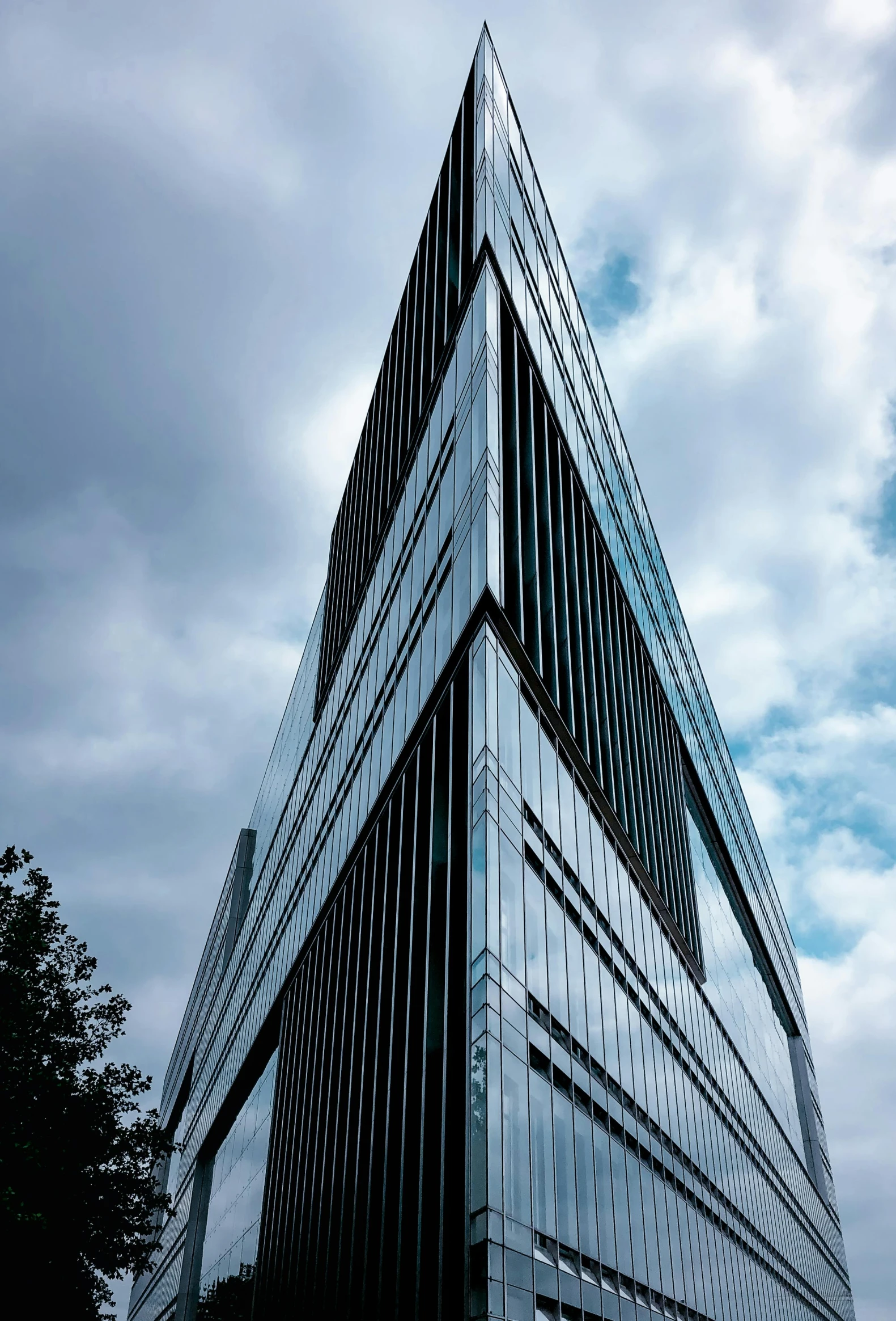 an unusual architecture building with very large windows