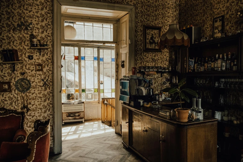 the room has floral wallpaper on the walls