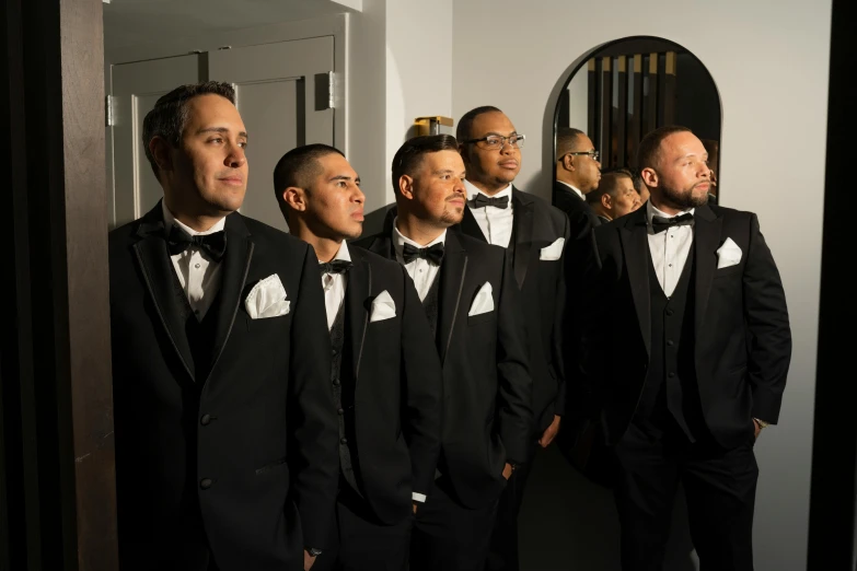 the men in suits are dressed for a night of singing