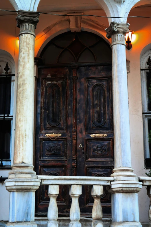 large, ornate front door of a three story home