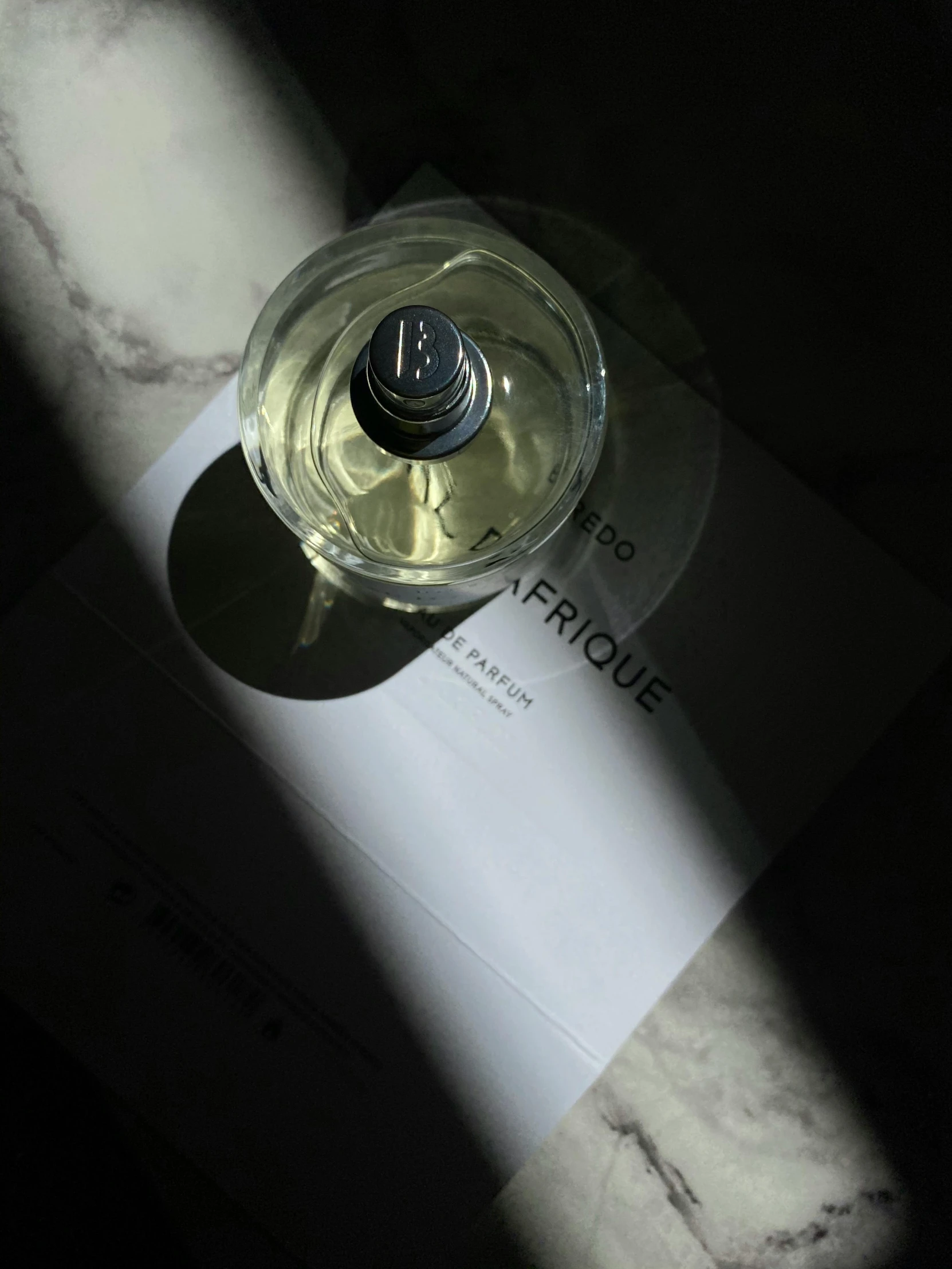 a bottle of white wine sits on top of a table