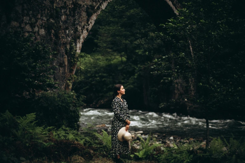 there is a woman standing alone in the water