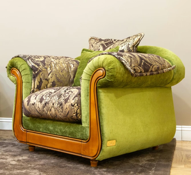 a green and brown chair sitting in a living room