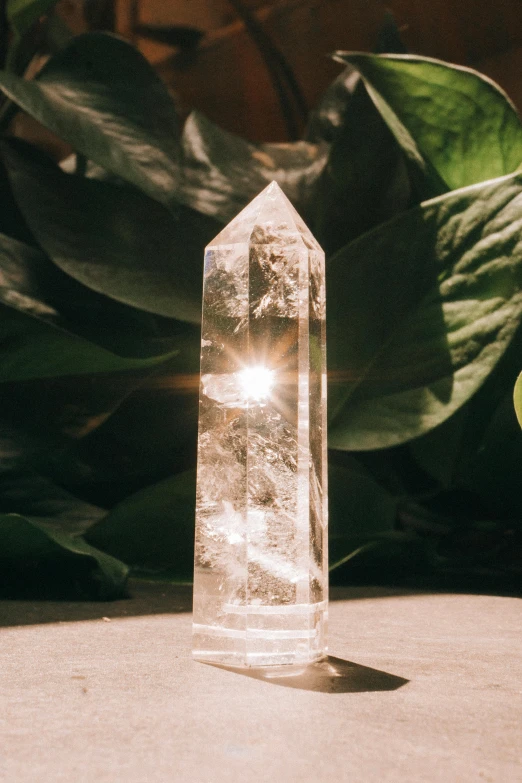 a clear crystal bottle with some light shining in