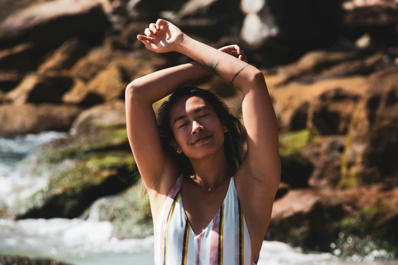 woman with her arms extended and head in the air