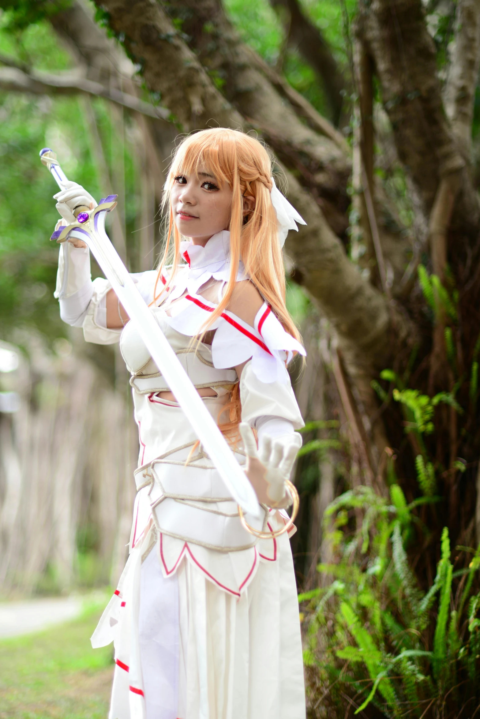 a woman in a cosplay with an attached sword