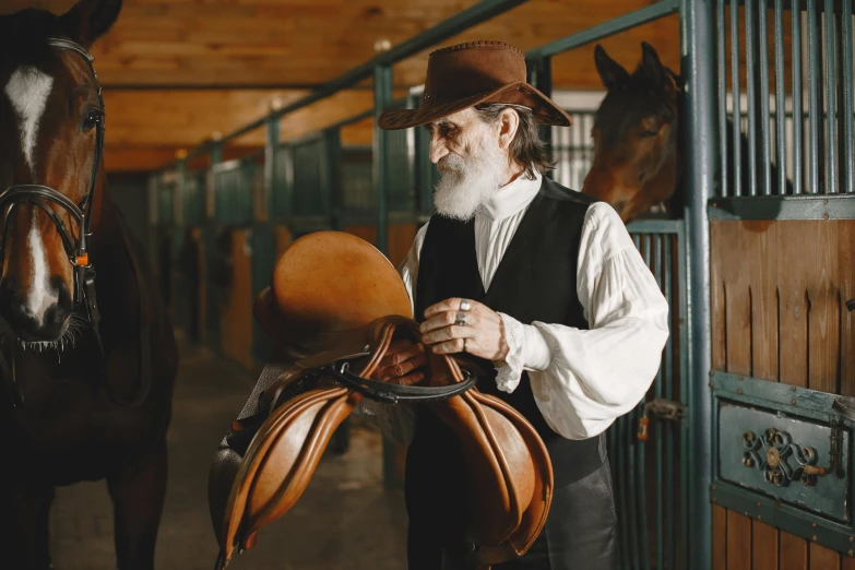 a man standing next to a horse in a barn