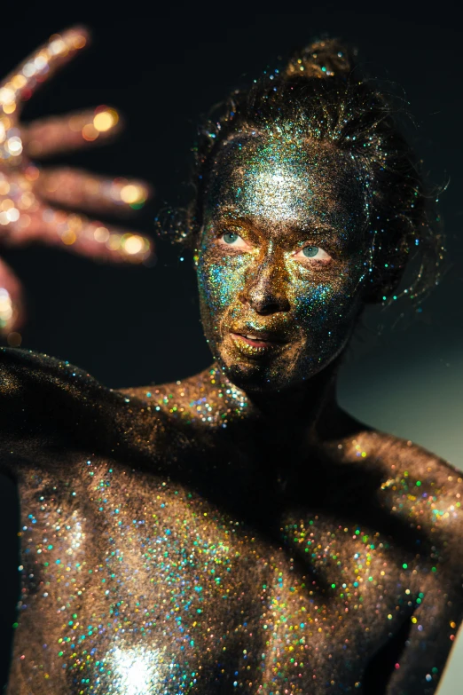 an image of a person with a glitter body and hands