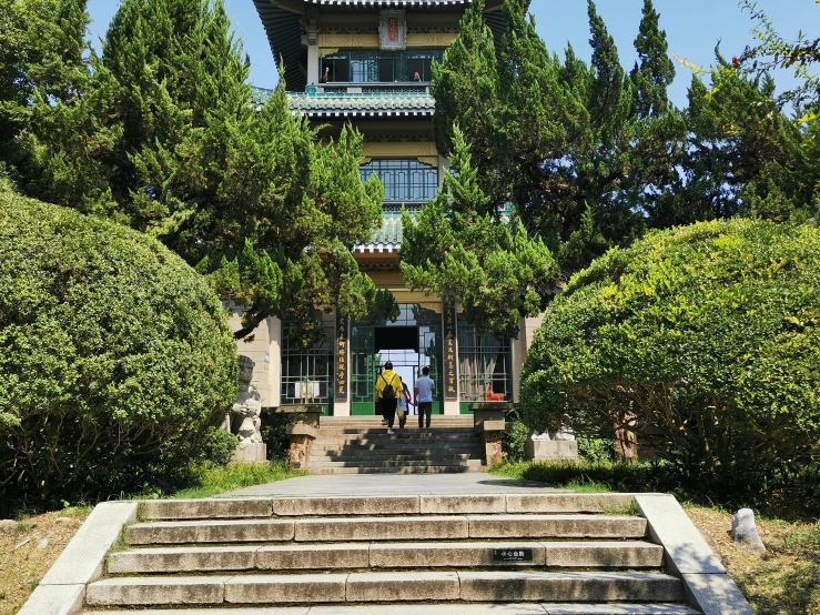 a stone stairway leading to an oriental building