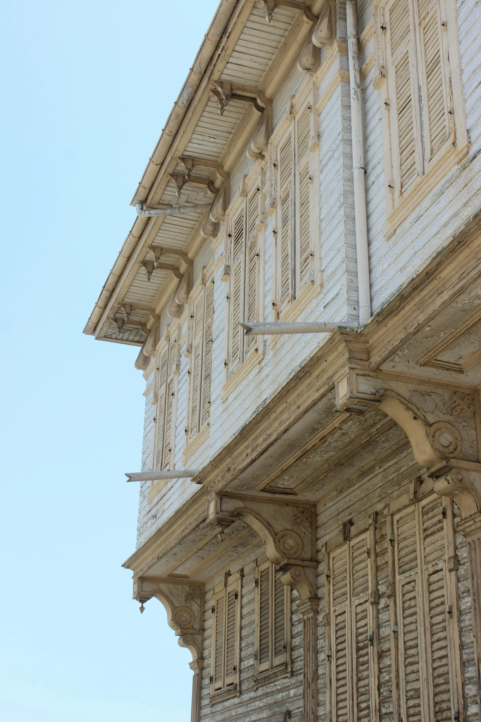 some white and brown building with lots of windows