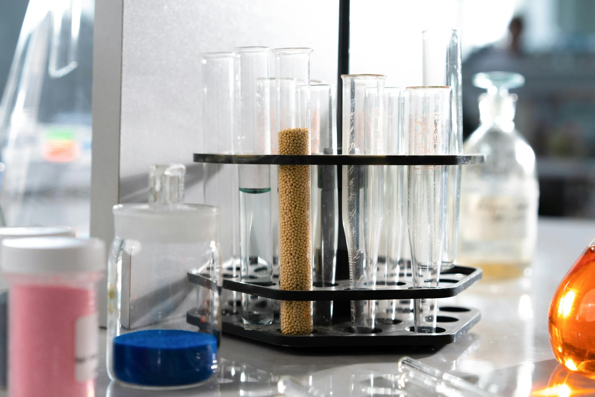 a science lab with flasks and beakles containing goldfish