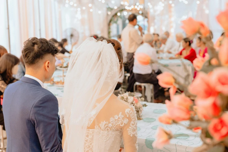 a bride and groom in a banquet hall