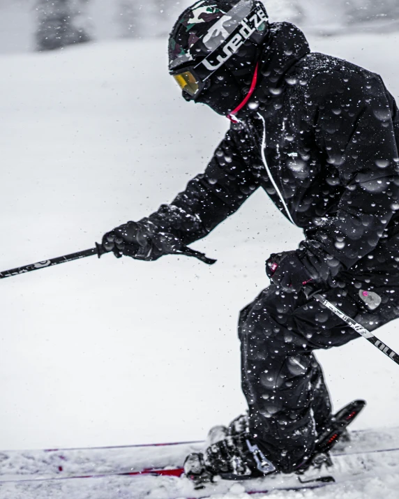 a person on skies riding through the snow