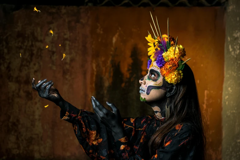 a woman with halloween makeup and flowers on her head