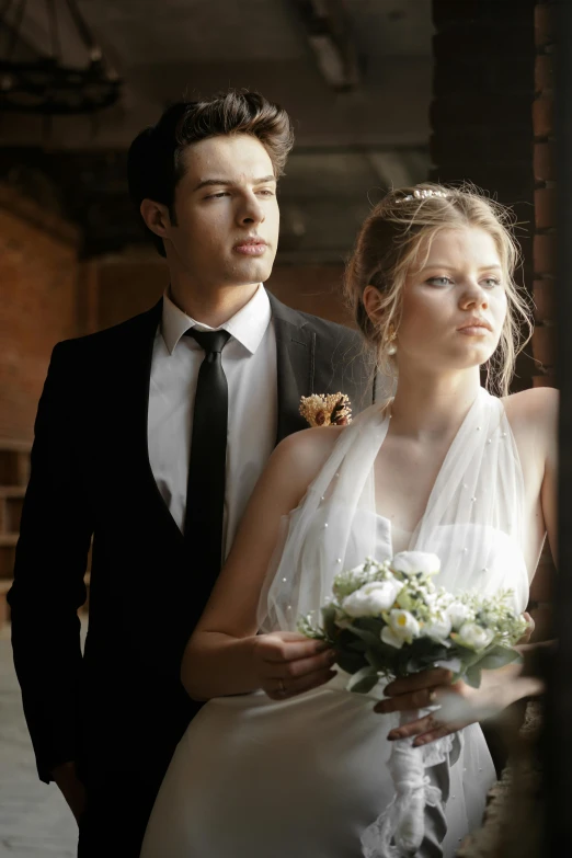 a young man and woman in formal wear