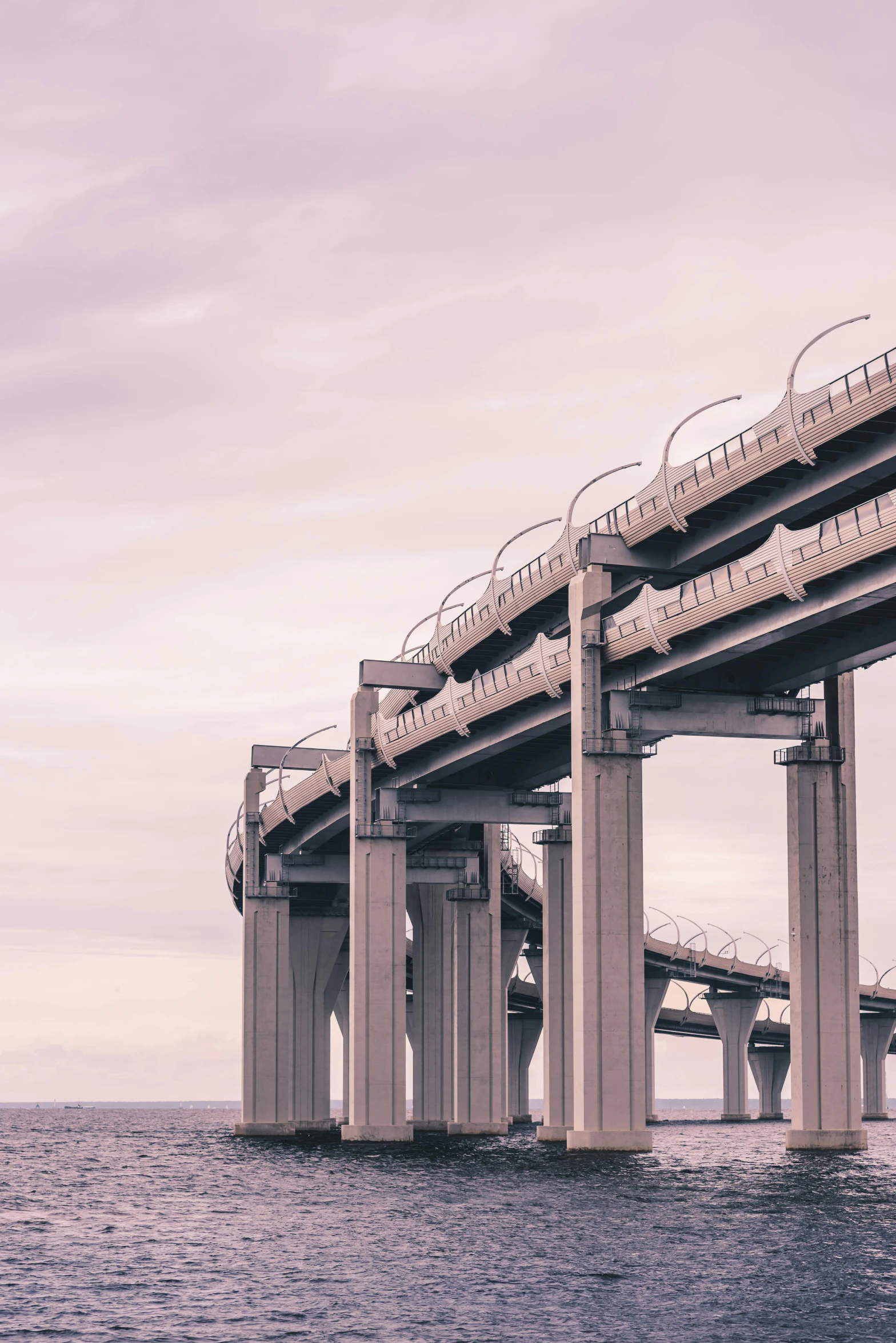 several bridges on the same part of a bridge with a building at the top and one way