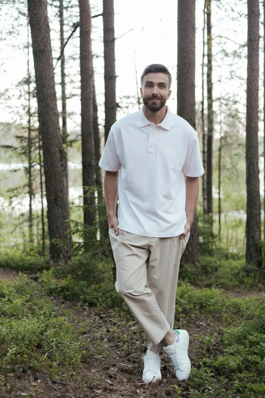 a man that is standing in the grass