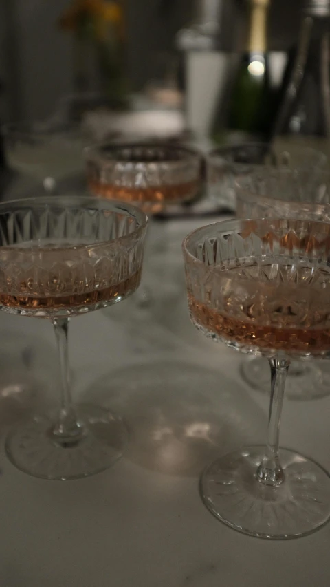 champagne being poured in martini glasses for a celetion