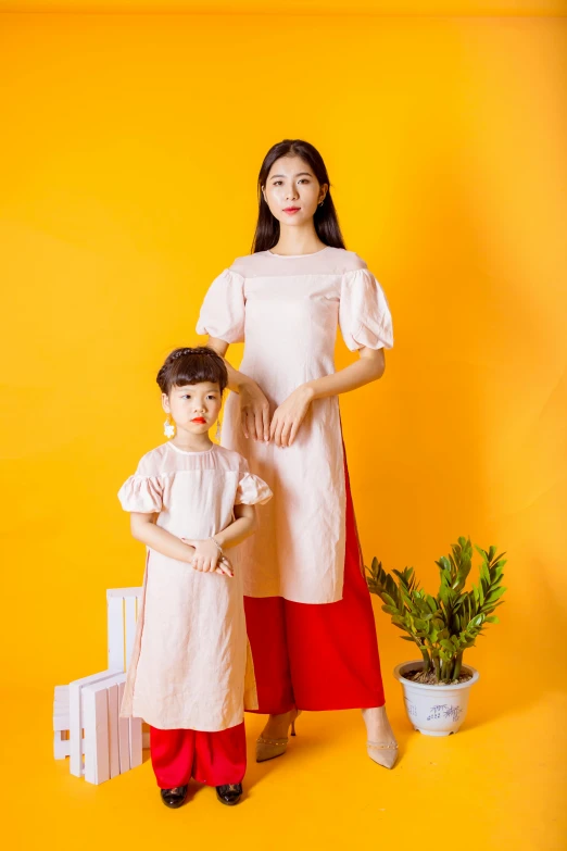 a mother and daughter posing together for a picture