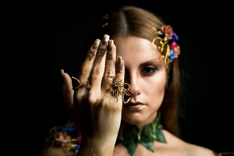 a woman with ring and jewelry on her hand