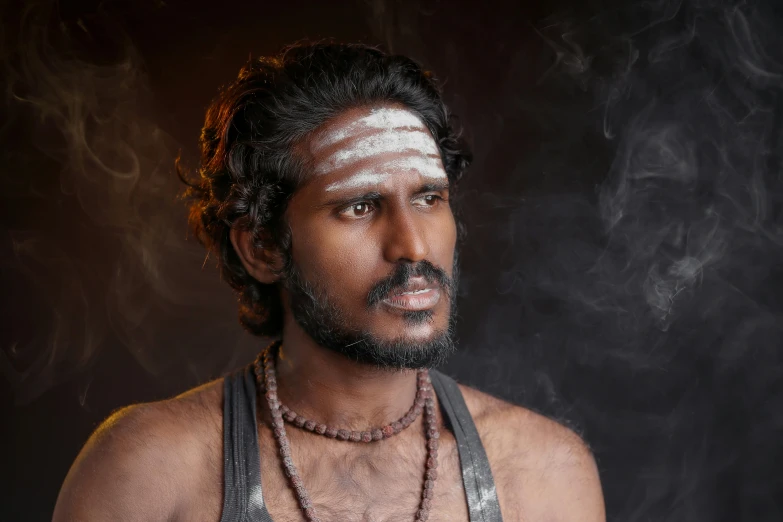 a man standing with smoke coming out of his chest