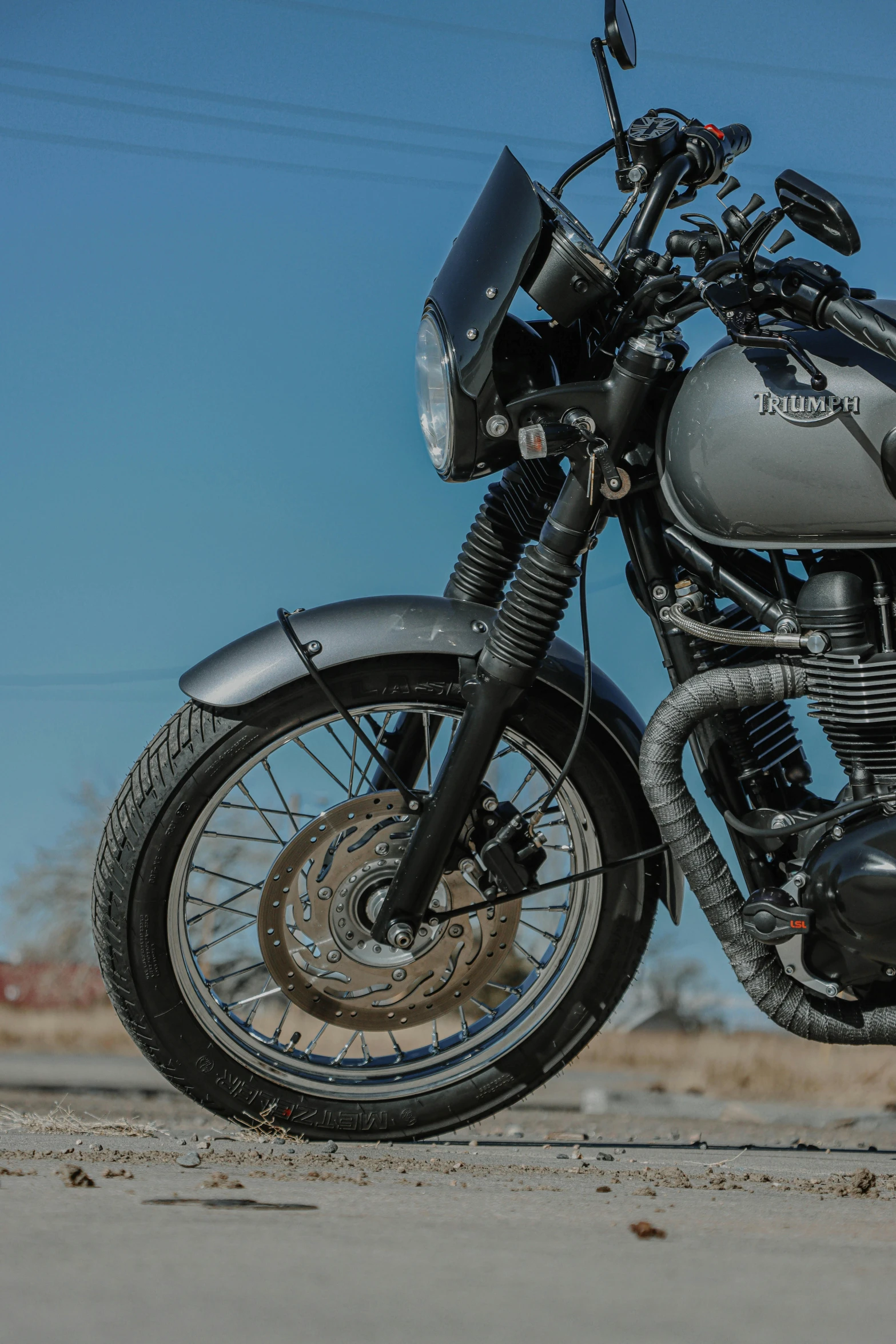 a black motorcycle with a clear sky in the background