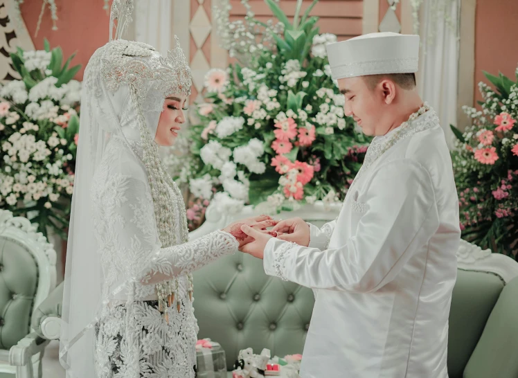 an elegant muslim bride with her groom in her wedding dress