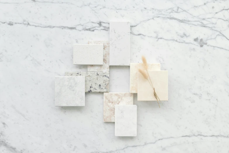 a white marble tile pattern in various squares