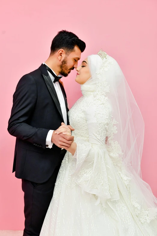 a bride and groom posing for the camera