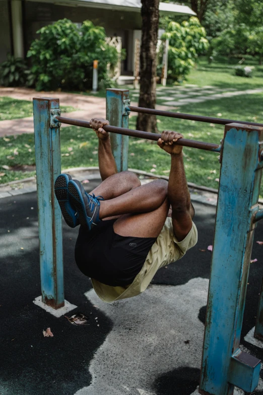 a person on a rope with a blue bench