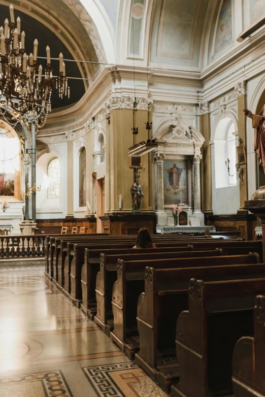 the inside of a church with wooden pews