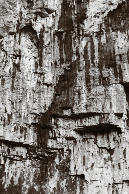 an older po of people climbing on large rock