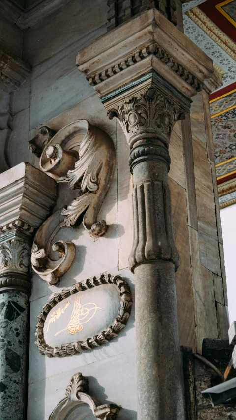 a fancy sculpture with ornamental details on the wall