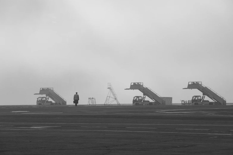 people stand on an overcast day by the water