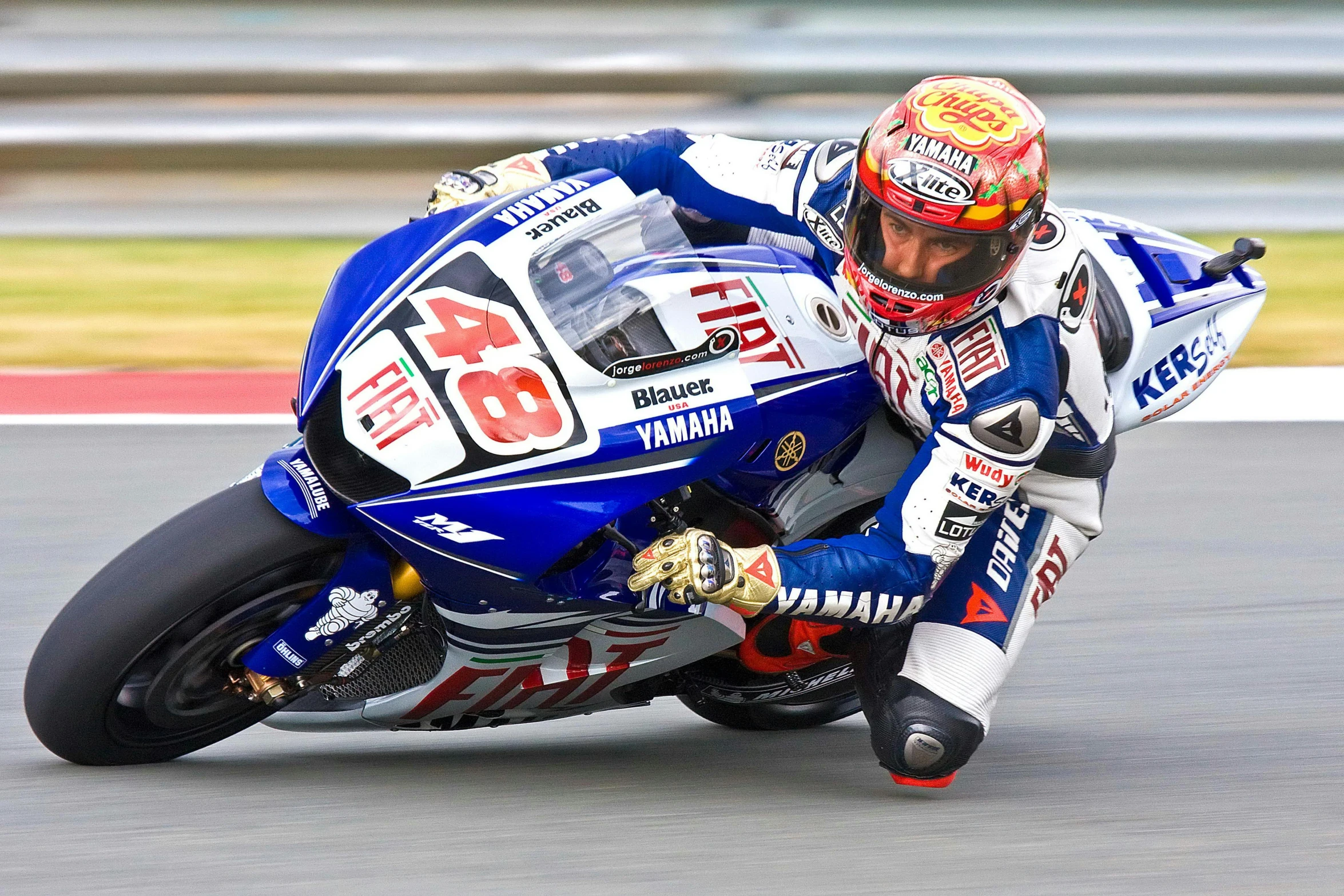 a person riding a motorcycle on a track